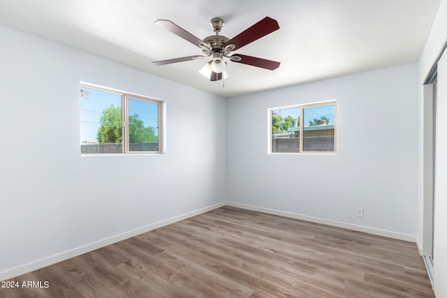 unfurnished room featuring ceiling fan and light wood-type flooring