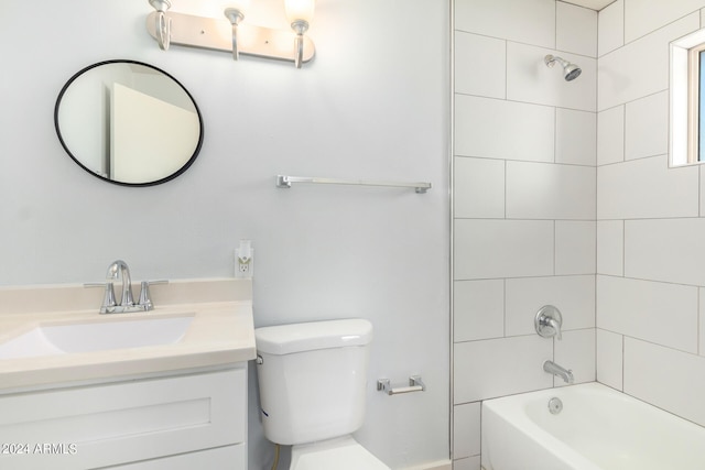 full bathroom with tiled shower / bath combo, vanity, and toilet