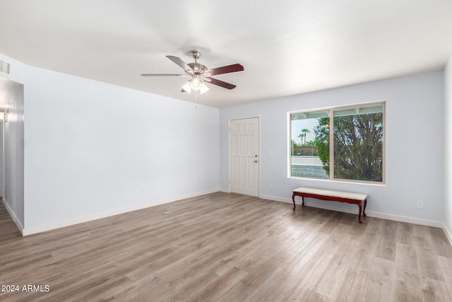 unfurnished room featuring ceiling fan and light hardwood / wood-style flooring