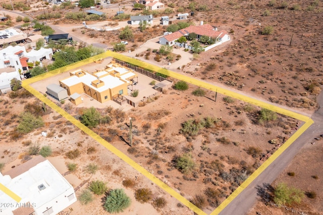 birds eye view of property with a desert view