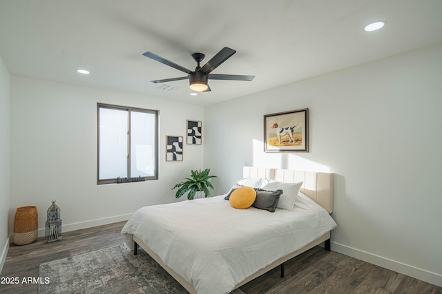 bedroom featuring dark wood-type flooring and ceiling fan