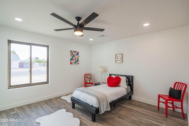 bedroom featuring ceiling fan and dark hardwood / wood-style flooring