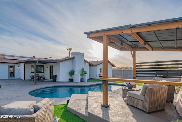 view of swimming pool with a patio area