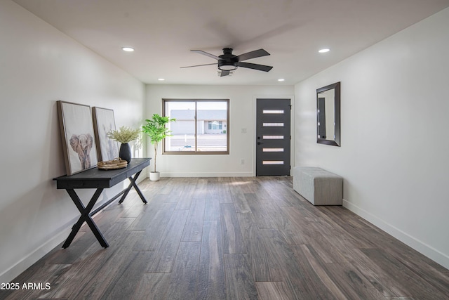 interior space with dark hardwood / wood-style floors and ceiling fan