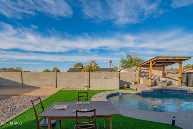 view of pool featuring a patio area, a gazebo, and a lawn