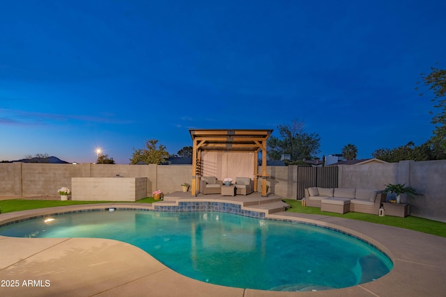 pool at dusk with a patio area and outdoor lounge area