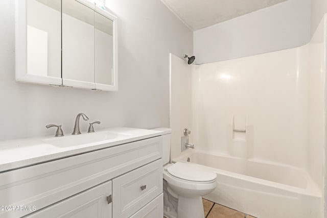 full bathroom featuring tile patterned flooring, vanity, washtub / shower combination, and toilet