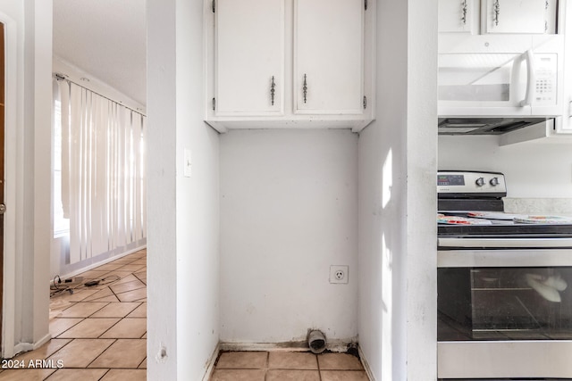 laundry room featuring light tile patterned floors