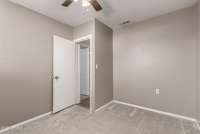 1113 E 5th St, Casa Grande, AZ 85122 - unfurnished bedroom featuring light carpet and ceiling fan