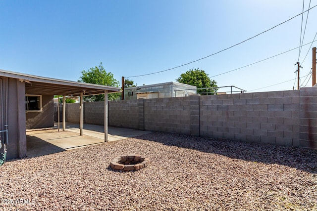 1113 E 5th St, Casa Grande, AZ 85122 - fenced backyard with a patio area and a fire pit