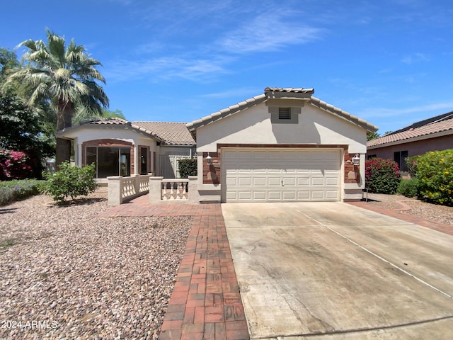 mediterranean / spanish house featuring a garage