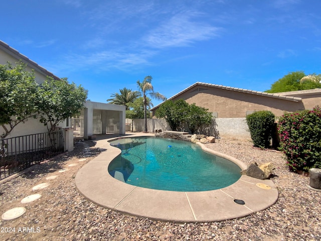 view of swimming pool with a patio area