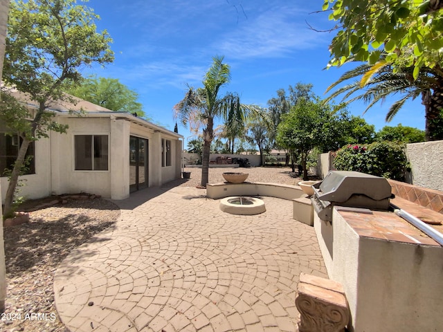 view of patio featuring a fire pit