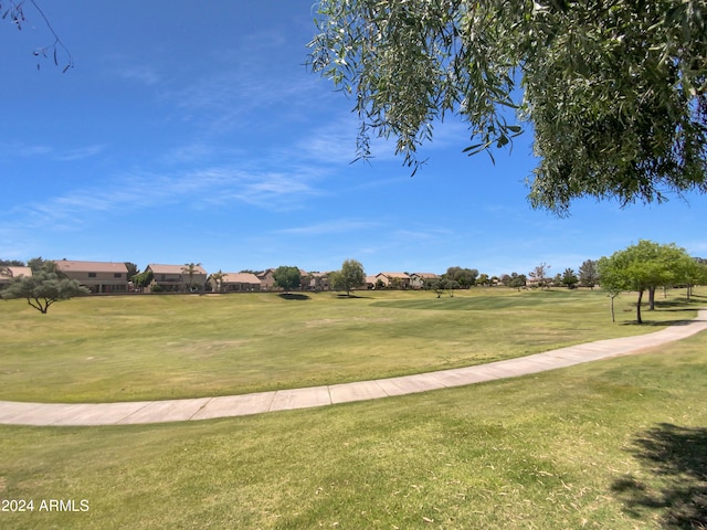 view of home's community with a yard