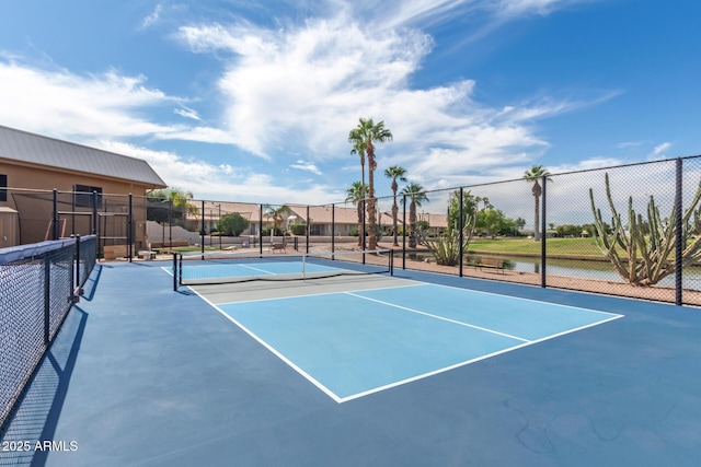 view of sport court featuring fence