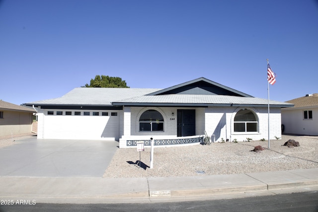 ranch-style home featuring a garage