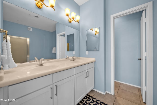 bathroom with vanity and tile patterned flooring