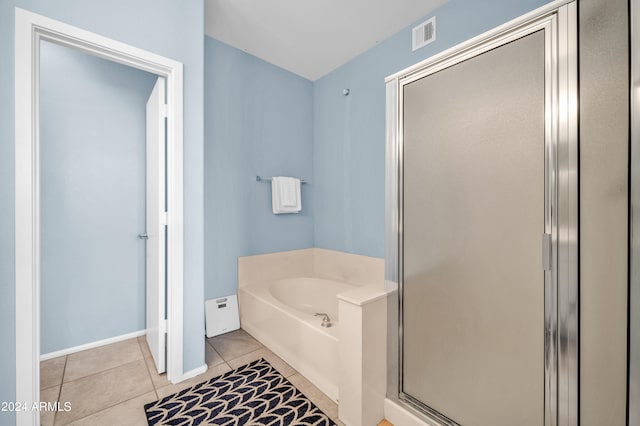 bathroom with tile patterned flooring and plus walk in shower