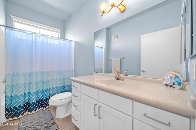 bathroom with vanity, toilet, and tile patterned floors