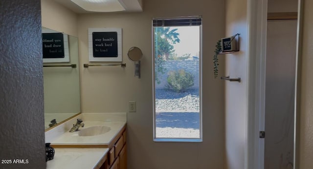 bathroom featuring vanity and a wealth of natural light