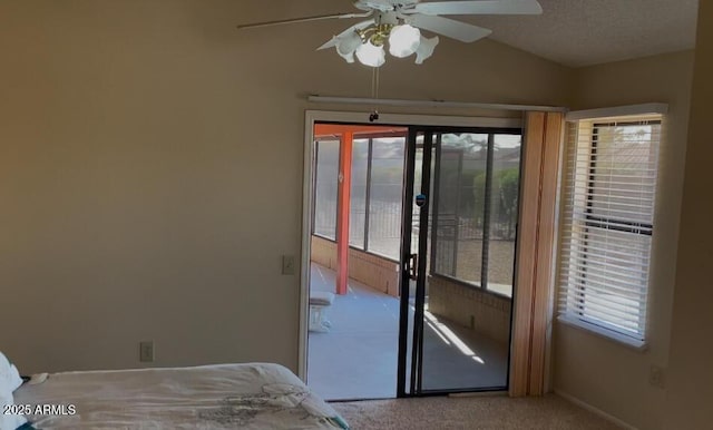 unfurnished bedroom featuring ceiling fan, carpet floors, and a textured ceiling