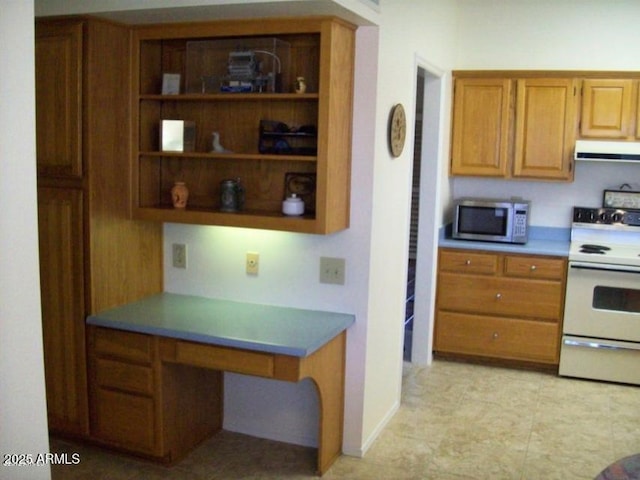 kitchen featuring range hood and white stove