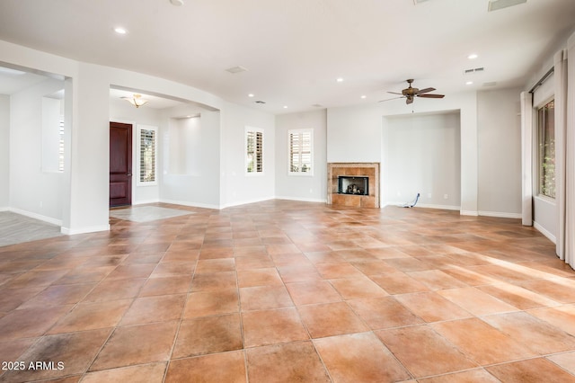 unfurnished living room with recessed lighting, baseboards, ceiling fan, and light tile patterned floors