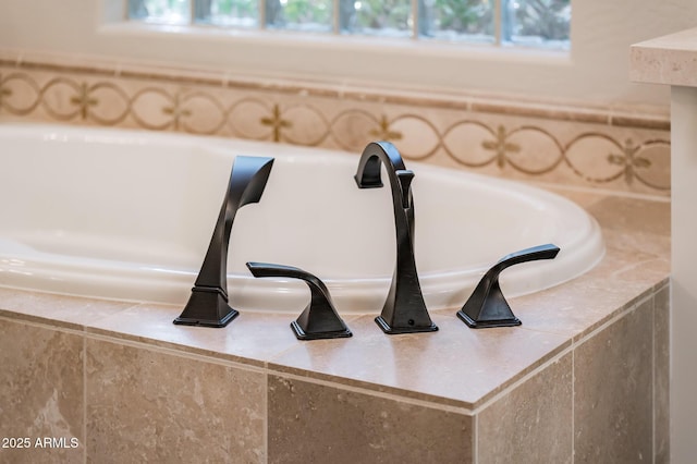 room details featuring a sink and a bath