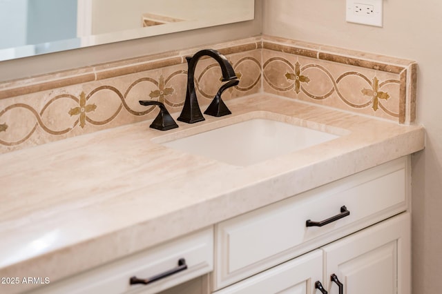 interior details with vanity and decorative backsplash