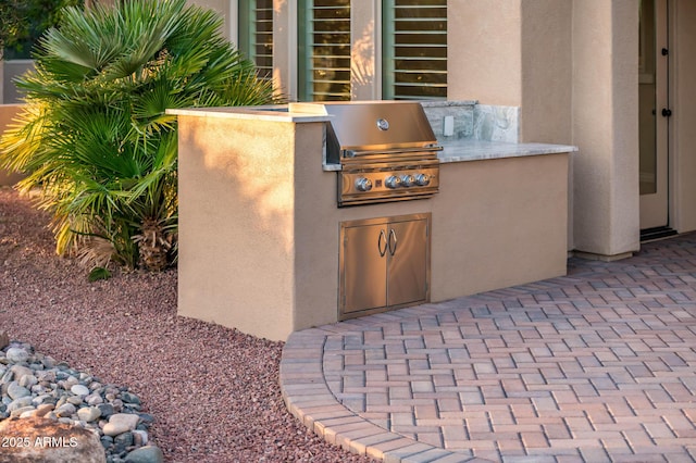 view of patio / terrace with grilling area and exterior kitchen