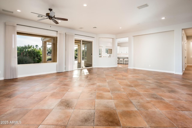unfurnished living room featuring ceiling fan, visible vents, light tile patterned floors, baseboards, and recessed lighting