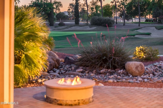 surrounding community with a fire pit