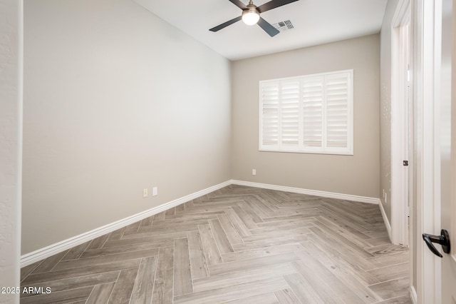 empty room featuring ceiling fan, visible vents, plenty of natural light, and baseboards