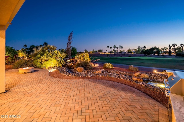 view of patio terrace at dusk