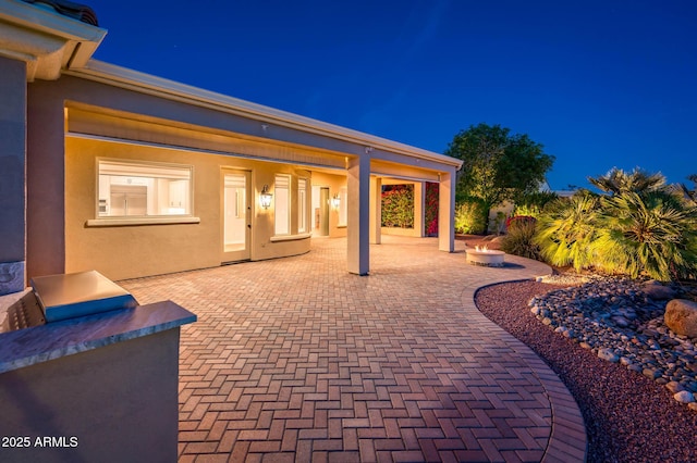 view of patio at twilight