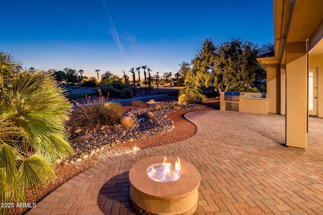 view of patio featuring a grill and an outdoor kitchen