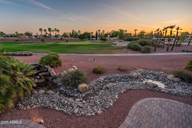 view of yard with view of golf course