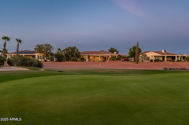 surrounding community with view of golf course