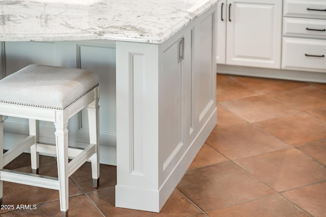 details with light countertops and white cabinetry