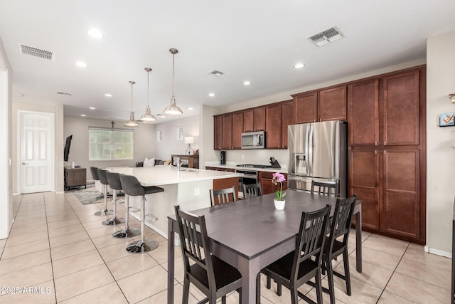 tiled dining area with sink