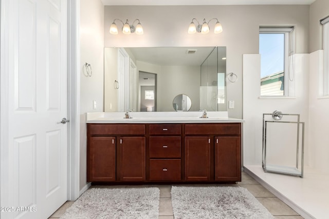 bathroom featuring tile patterned flooring and vanity