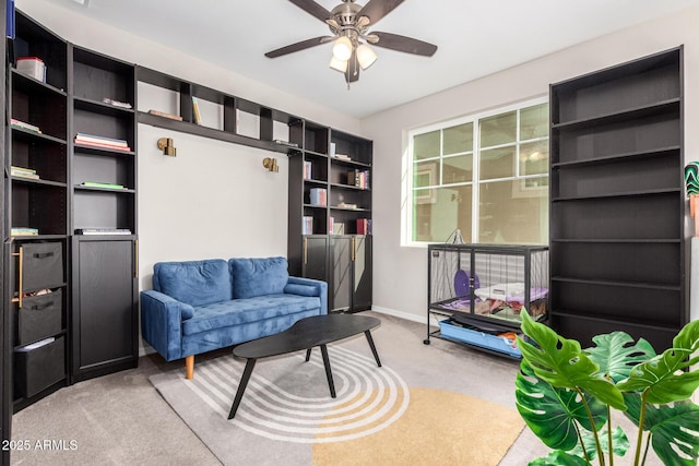 living area with ceiling fan and light colored carpet