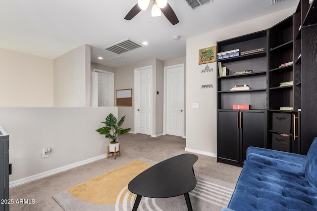 interior space with light carpet and ceiling fan