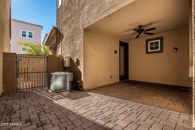 view of patio / terrace with ceiling fan and central AC unit