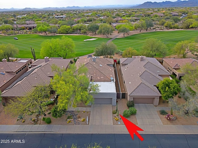 bird's eye view with a mountain view, golf course view, and a residential view