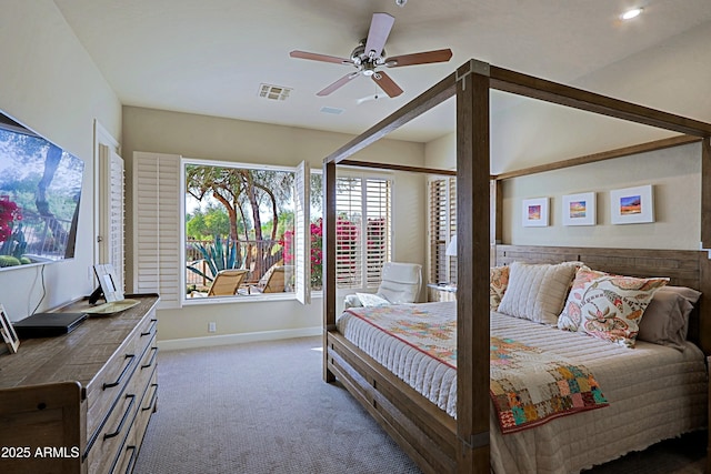 carpeted bedroom featuring baseboards, ceiling fan, and visible vents