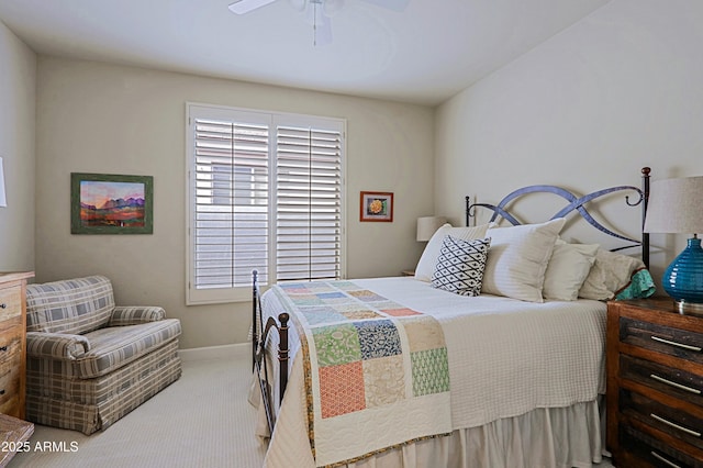 carpeted bedroom with baseboards and ceiling fan