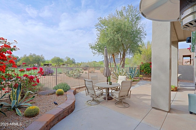 view of patio / terrace featuring outdoor dining area and a fenced backyard