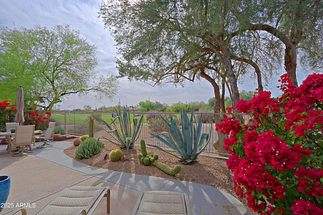 view of patio / terrace with outdoor dining area and fence