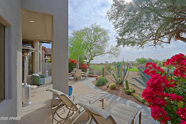 view of patio with outdoor dining space and fence private yard